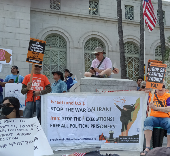 IEC banner at Los Angeles march against the Trump fascist regime during June 2025 US/Israel 12-day war on Iran.