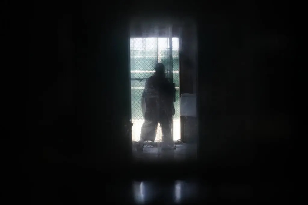An inmate stands at the doorway to a recreation yard in 2019 at the main Guantánamo Bay prison complex, where prisoners from Camp 7 were moved after its closure. 